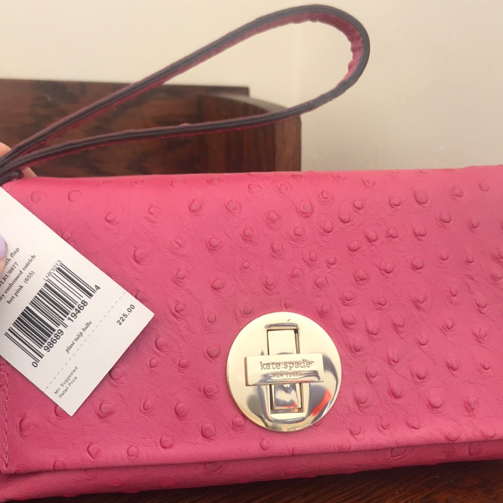 Pink Kate Spade clutch with embossed ostrich